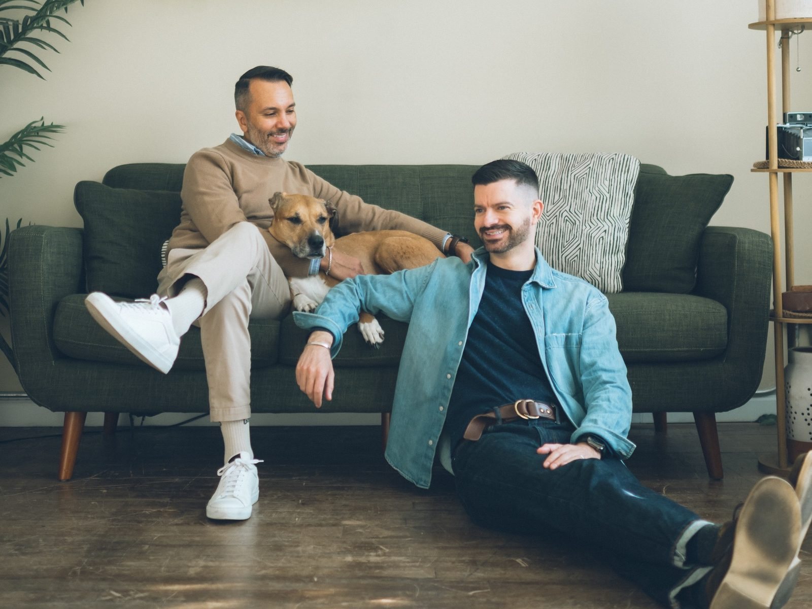 Eddie and Eric on a green sofa with Maya