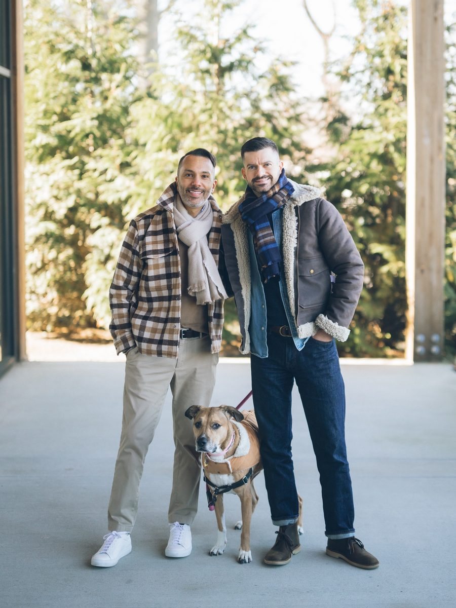Eddie and Eric standing outdoors with Maya