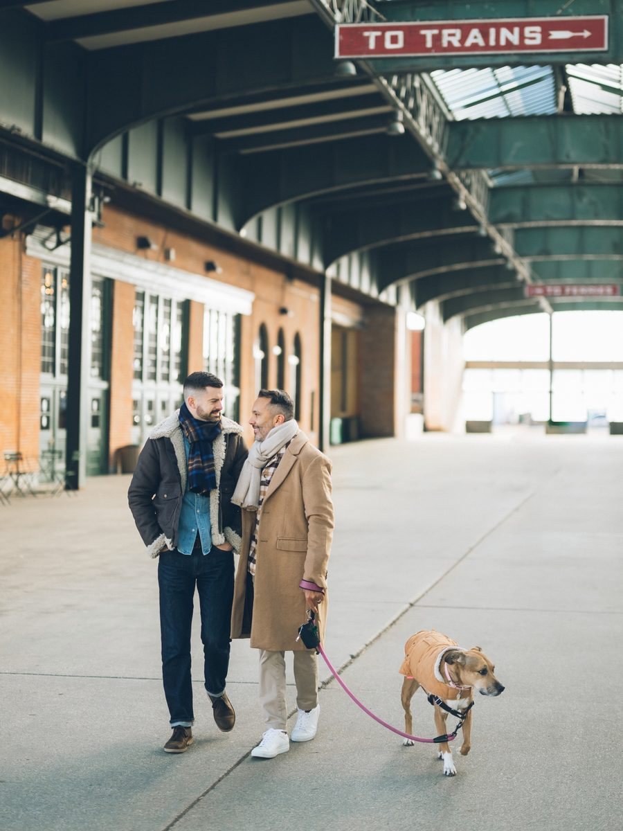 Eddie and Eric walking Maya through a train station